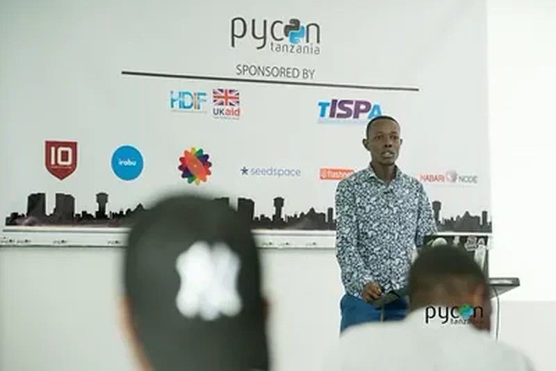 Noah Maina, Convener and Lead Organizer, addressing the room at PyCon Tanzania
